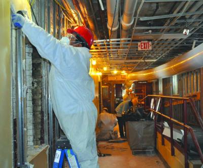 Workers remove damaged walls inside old St. Margaret School building: Photo by Bill Forry